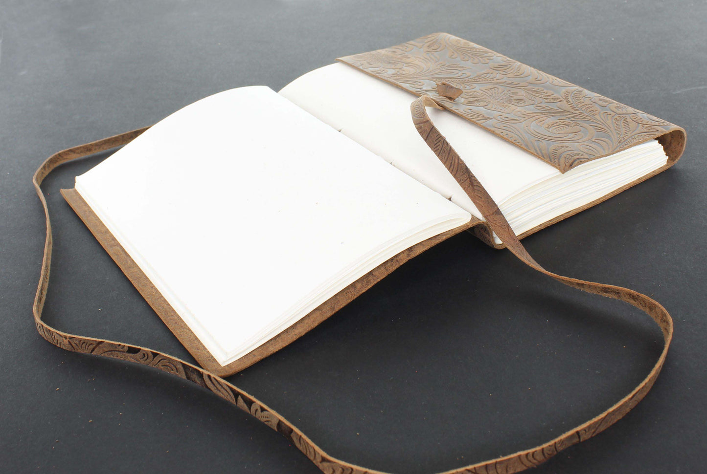 Embossed Leather Journal with String Closure, each