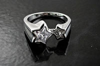 Rising Star Cut 4 and 7mm CZ-Stones in a Silver Ring Setting, size 6,