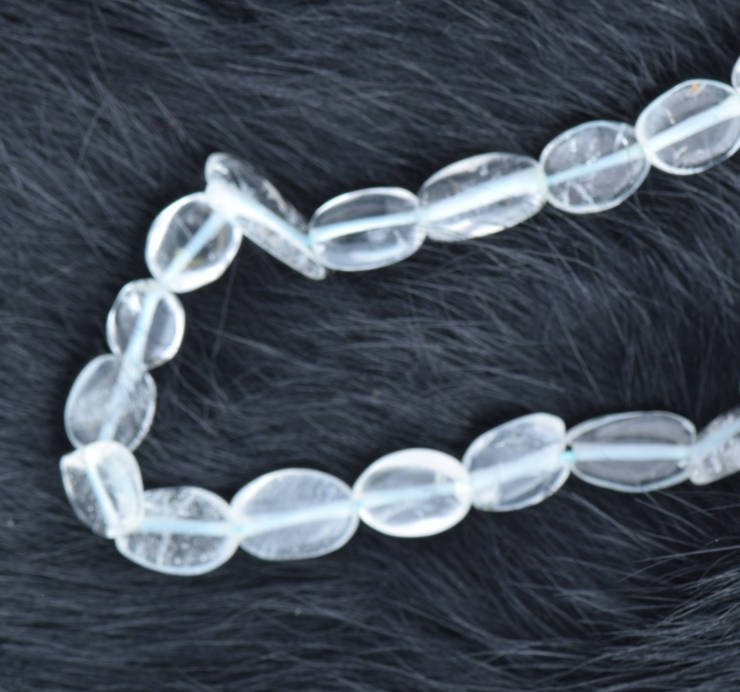 Flat Oval Blue Topaz Beads Sold by 16 inch strand