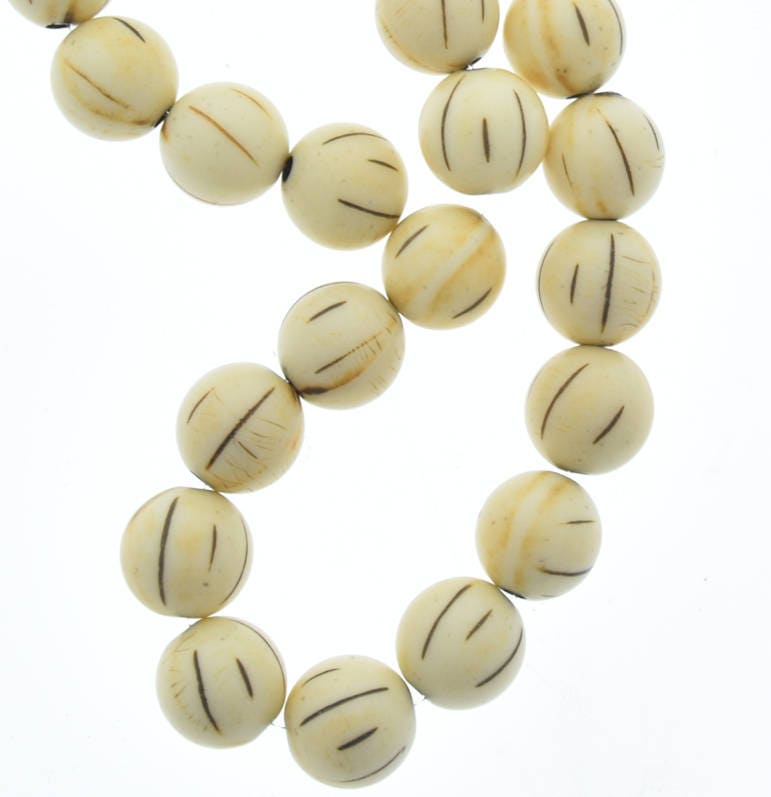 acrylic antique bone color beads 11mm, strand