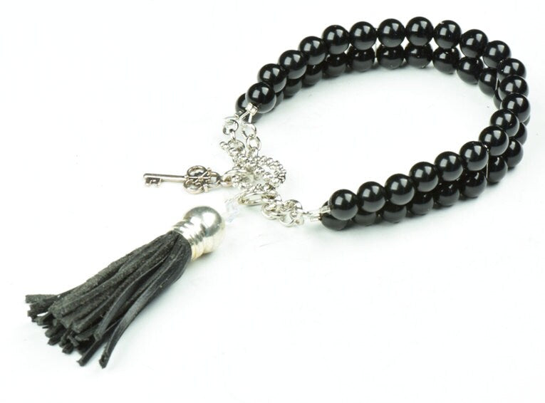 Black beaded bracelet with tassel, each
