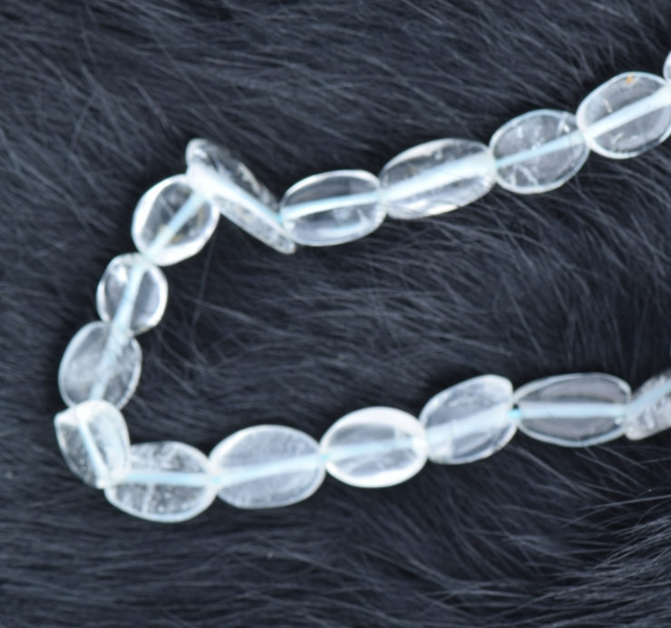 8x6mm Flat Oval Blue Topaz Beads Sold by 16 inch strand