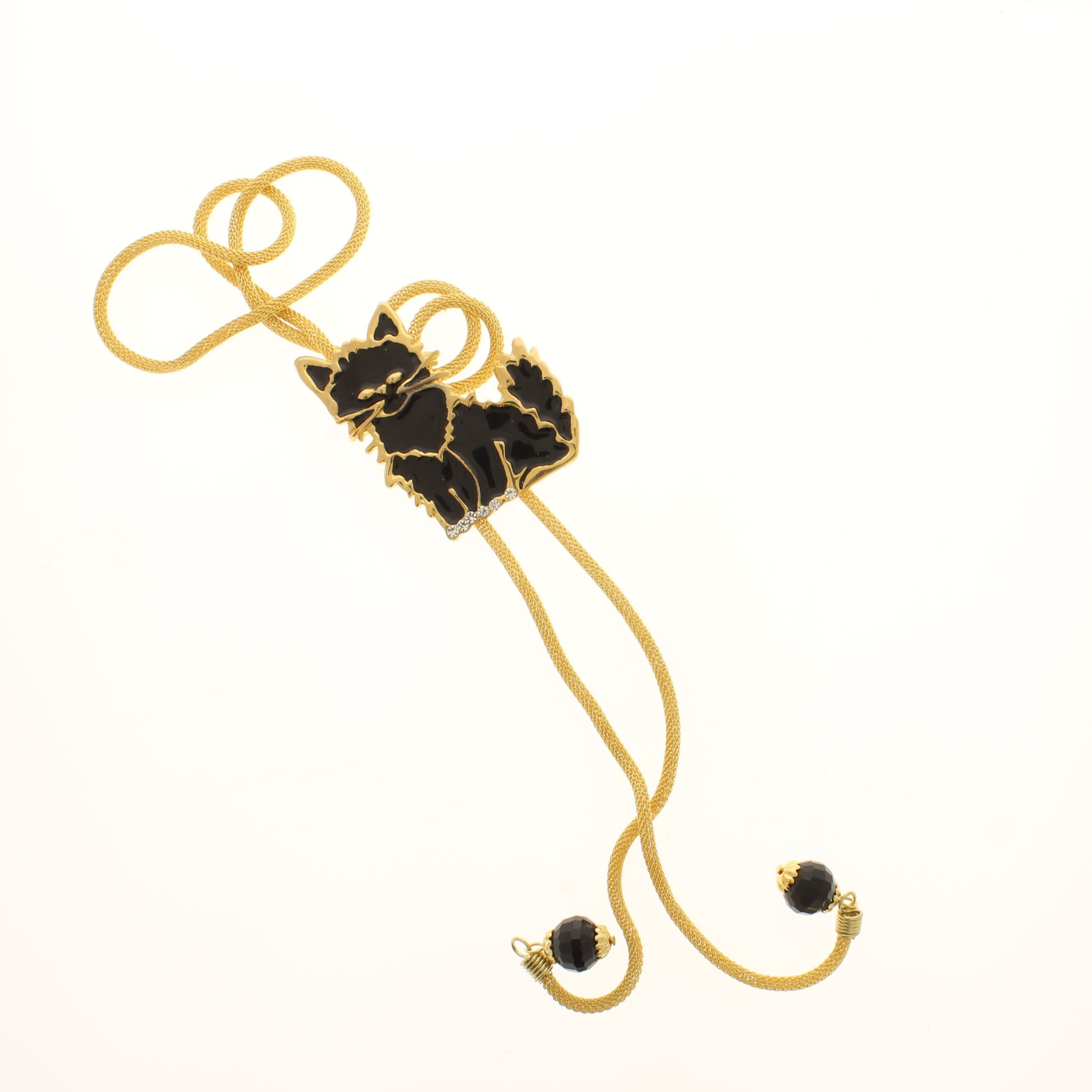 Halloween bolo tie featuring a black cat design with gold detailing on a golden cord, finished with black bead tips.
