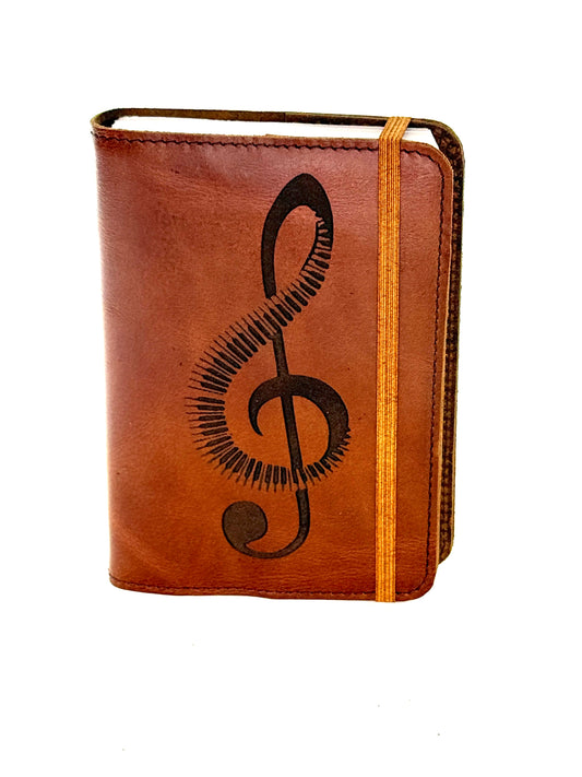 Music journal with piano or guitar treble clef