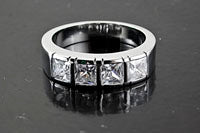 Princess Cut 4mm CZ-Stones in a Silver Ring Setting, size 7  ea