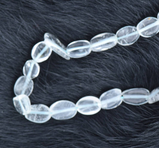 Flat Oval Blue Topaz Beads  Sold by 16 inch strand