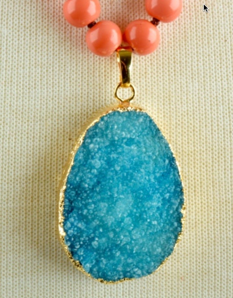 Druzy Turquoise Oval Pendant with gold leaf edge on Peach Coral knotted bead necklace, each
